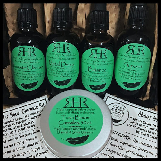 Set of RHR cleanse kit tinctures and a tin  of binders with green labels.