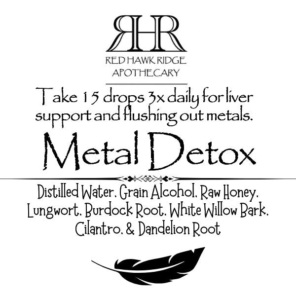 Red Hawk Ridge Apothecary Metal Detox product label with text and logo.